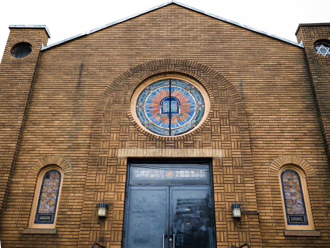 A church with details in the brick and stained glass