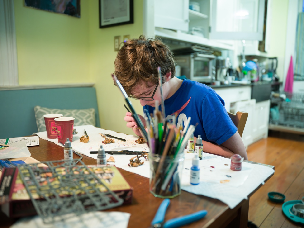 A boy painintg mniatures