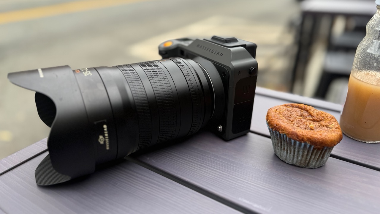Hasselblad X2D II 100C on a table with a muffin